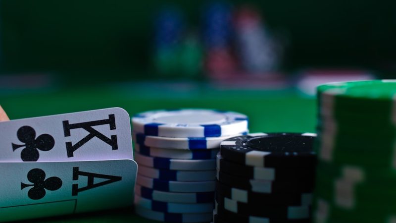 white and black dice on green table