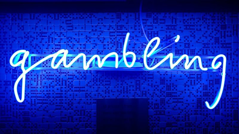 blue gambling neon signage