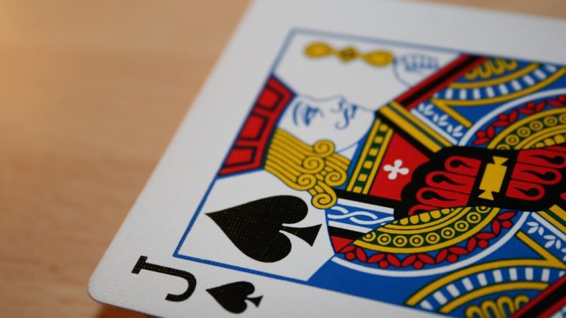 a close up of a playing card on a table